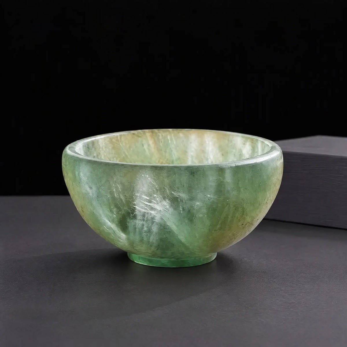 Polished crystal tea bowl, green stone
