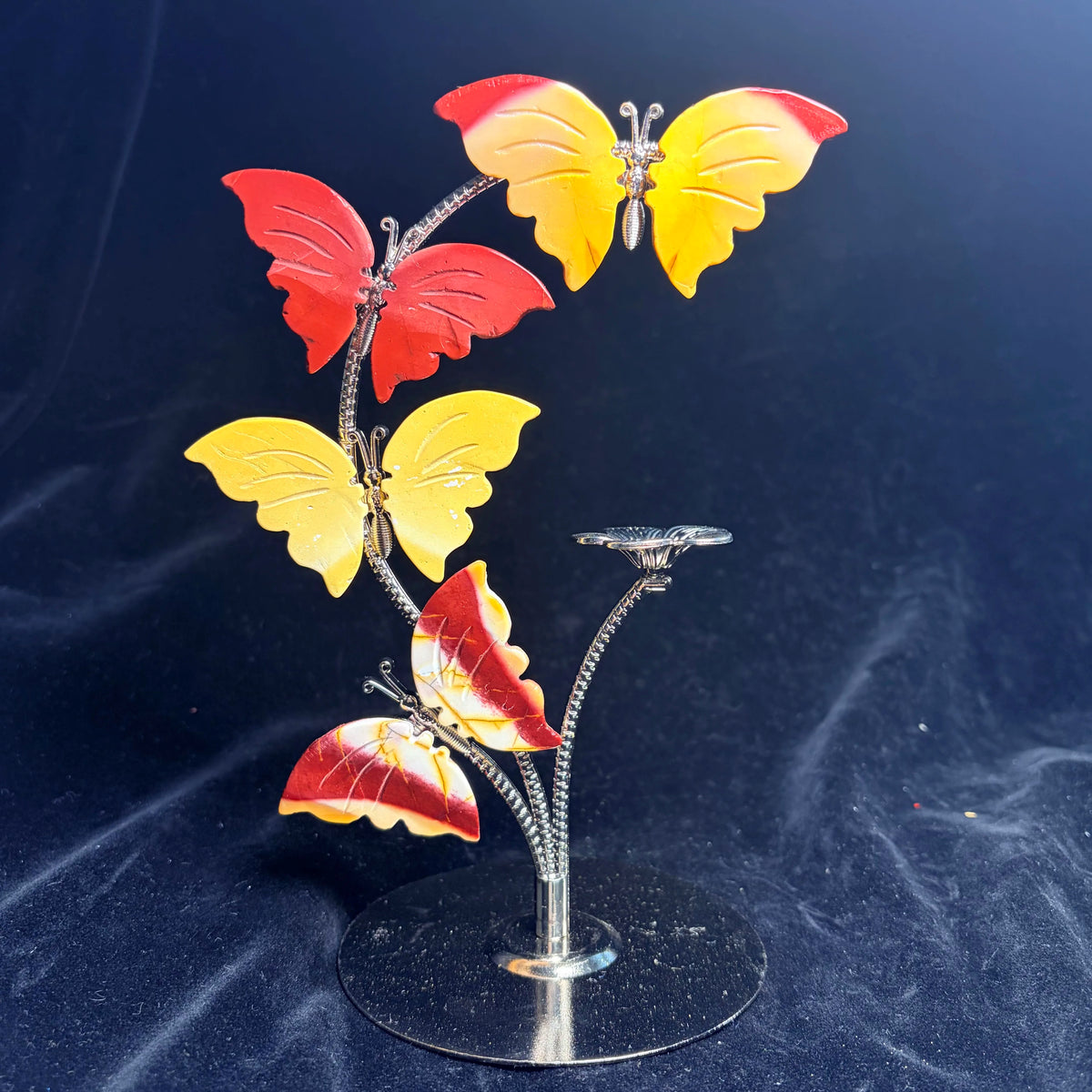 Crystal butterfly ornament on metal stand, yellow and red stone wings