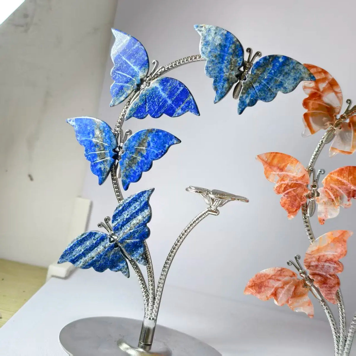 Crystal butterfly ornament on metal stand, blue stone wings