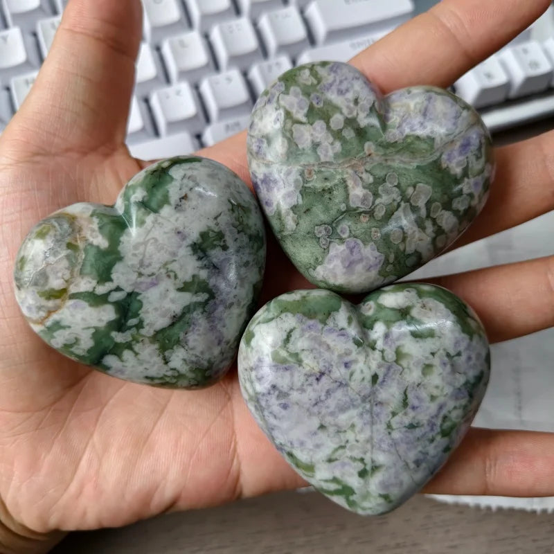 Crystal cluster heart carvings in hand