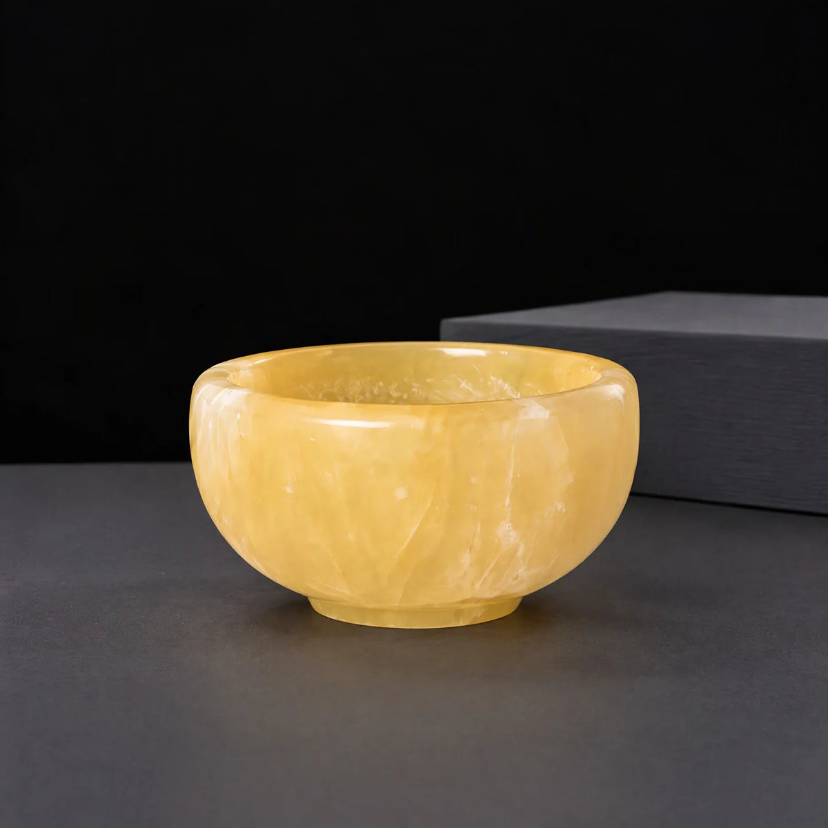 Polished crystal tea bowl, yellow stone