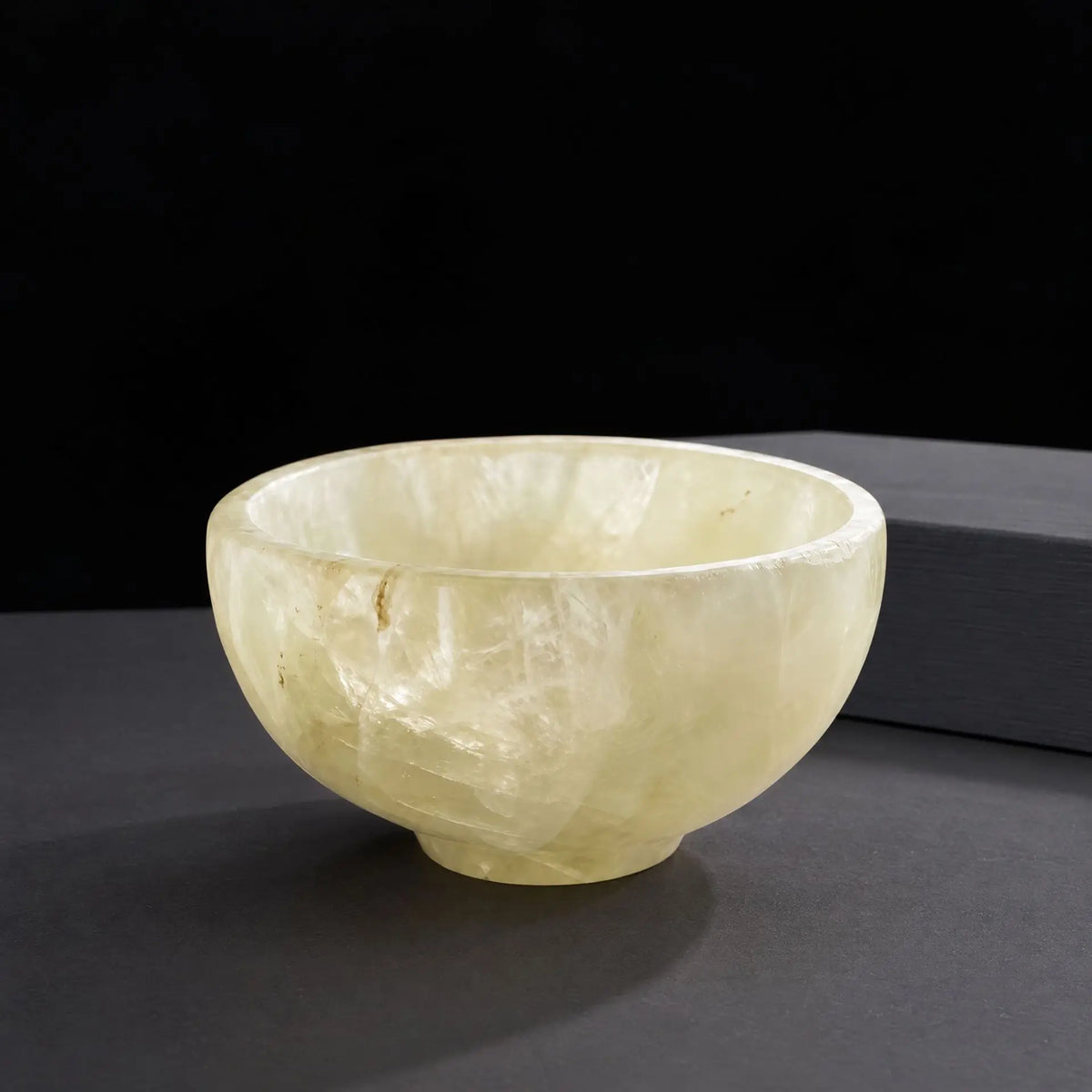 Polished crystal tea bowl, pale yellow stone