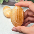 Natural Yellow Calcite Pocket Palm Stone Home Office Table Decoration Nice Holiday Gift for Crystal Collectors